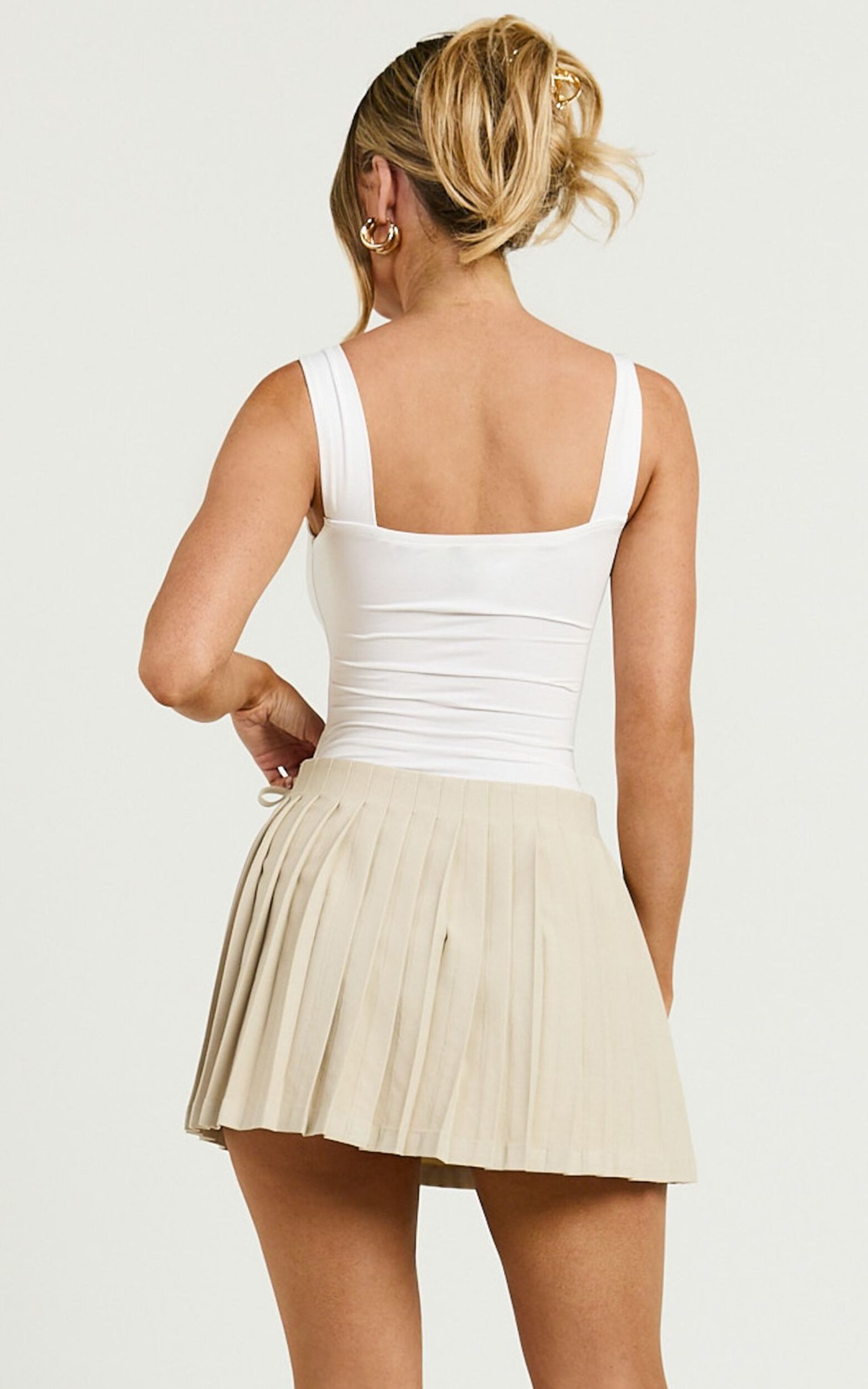 Camilla Mini Skirt - Mid Waist Pleated Back Bow Detail Skirt in Stone